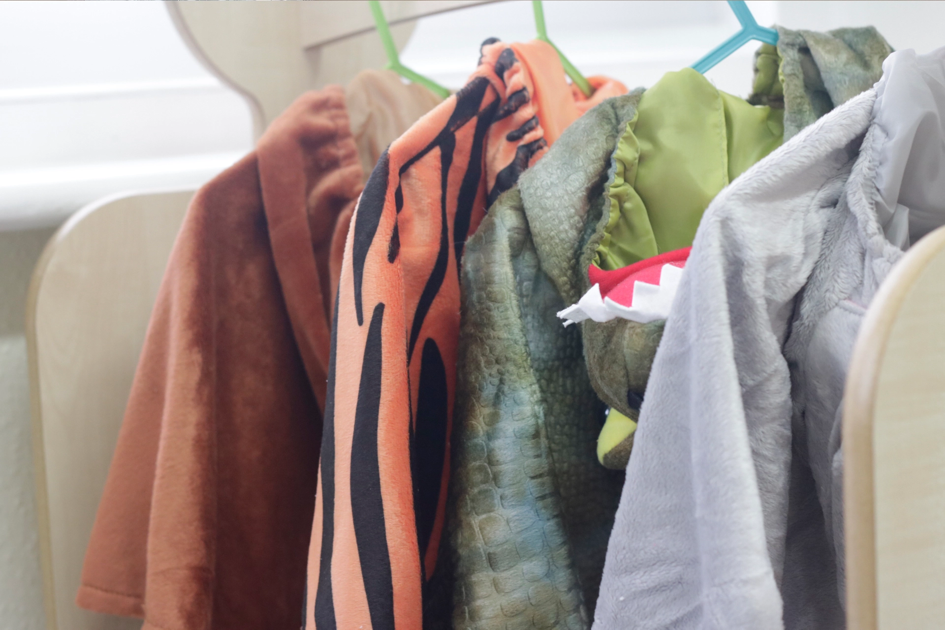 Imagination room - picture of children's play outfits hanging up